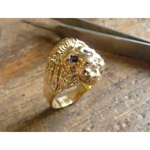 Bague or jaune 9 KT tête de lion Marjan avec saphir